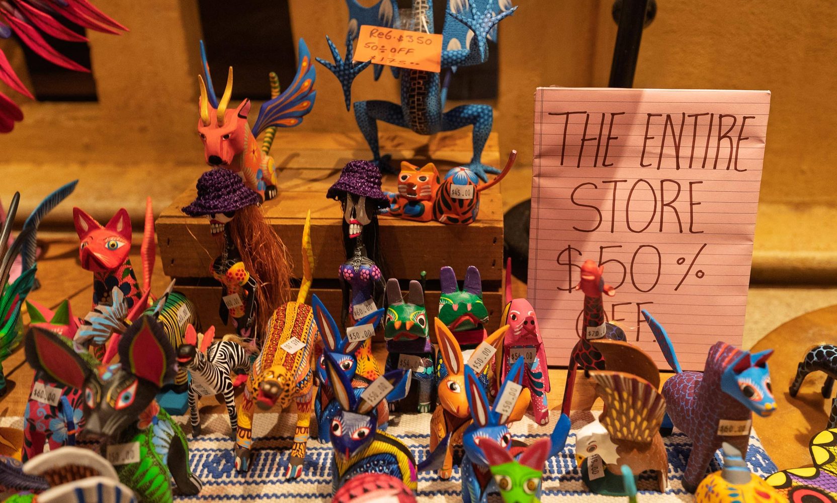 EPCOT's Oaxacan wood carvers are leaving the Mexico pavilion at the end of August, and the whole stand is 50 percent off