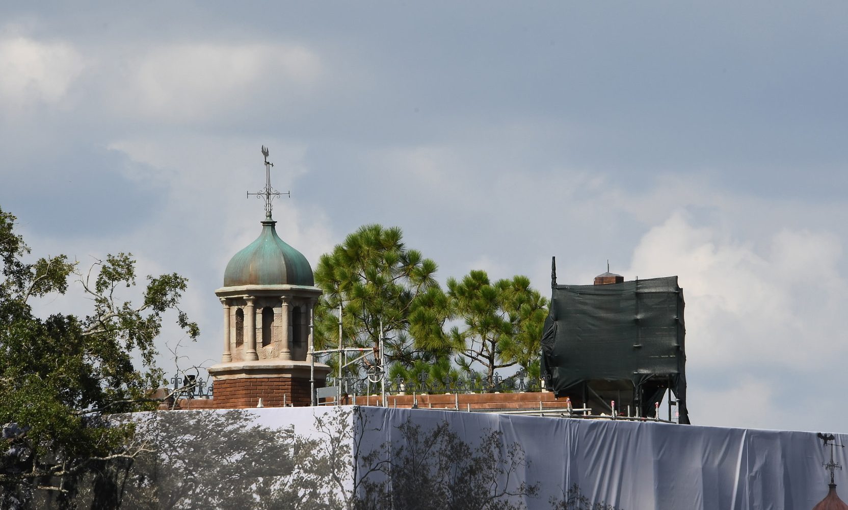 More Scrim Comes Off the Haunted Mansion and the Facade Underneath Has Changed: Green Cupola, Darker Brick, Lighter Stone