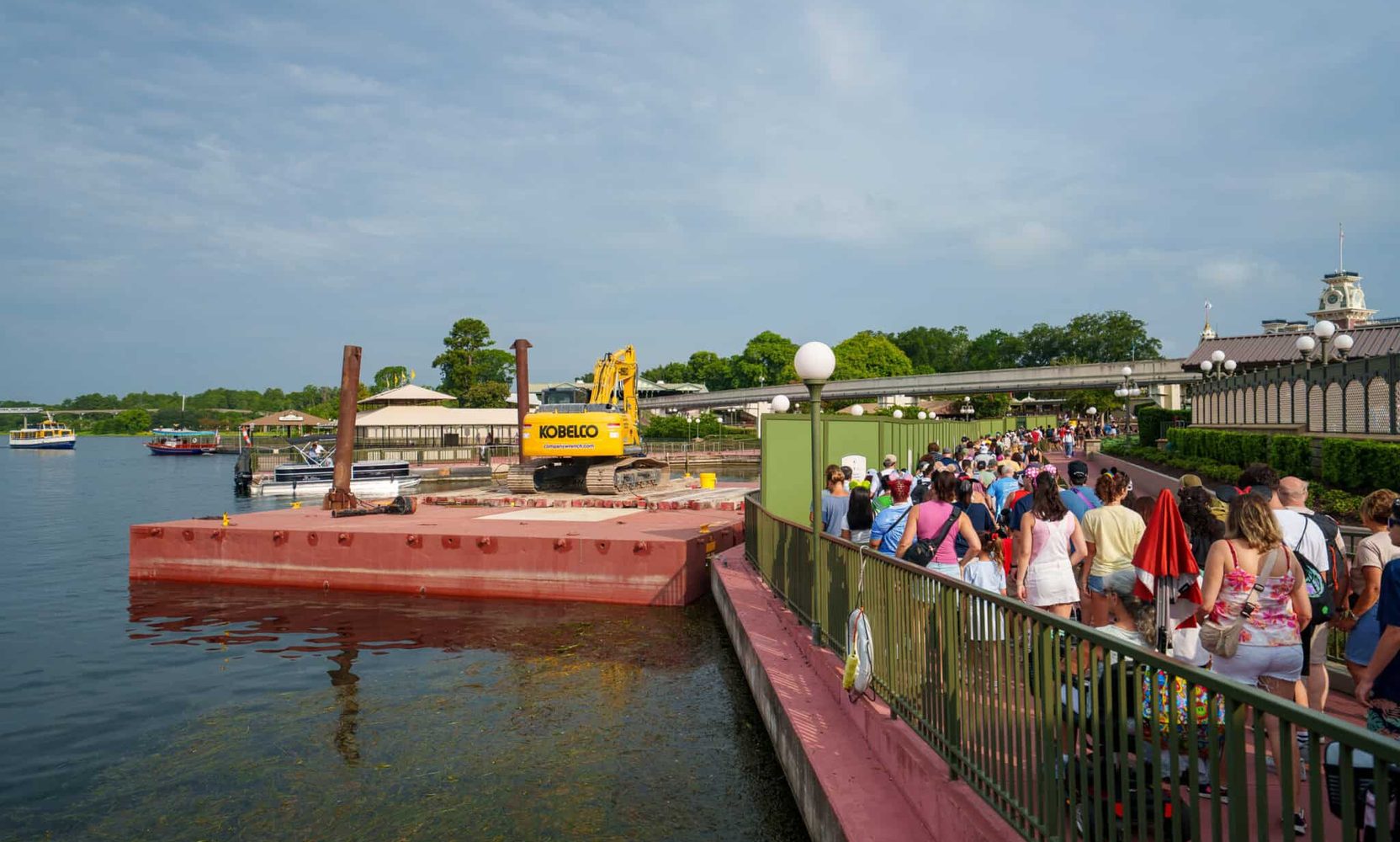 A Construction Barge and Excavator Are Now Parked in the Seven Seas Lagoon as Magic Kingdom’s Ferryboat Dock Project Moves Into the Water