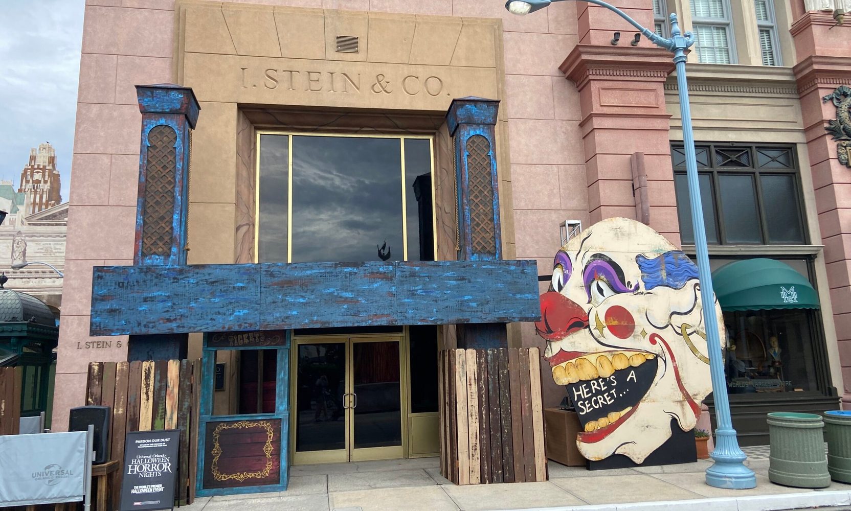 A giant clown face and a blue carnival wagon have landed at Universal Studios Florida as Halloween Horror Nights 35 sets go up