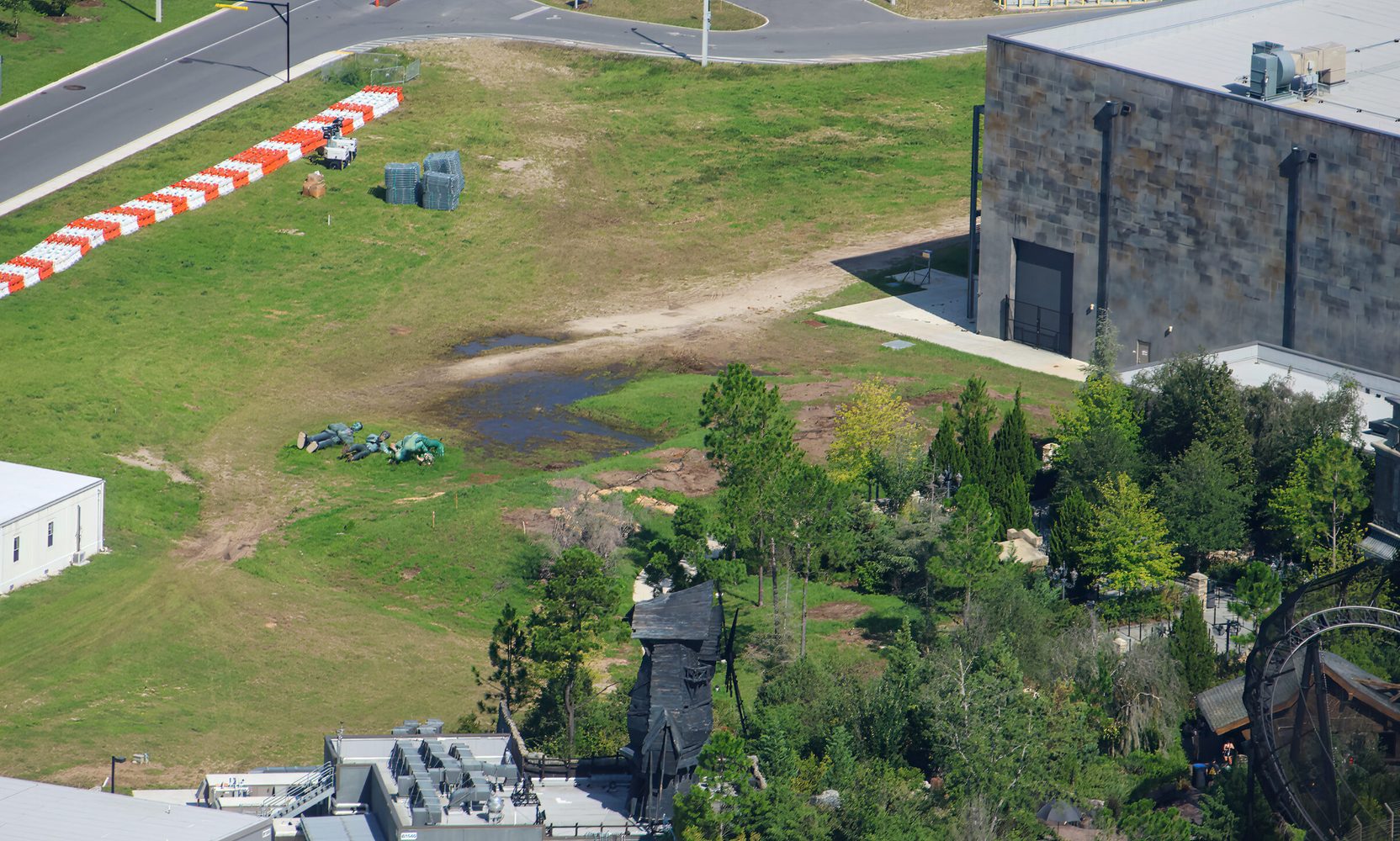 The Monsters Cafe Statues Are Lying in the Grass Behind Dark Universe, Where Universal Just Cleared the Trees