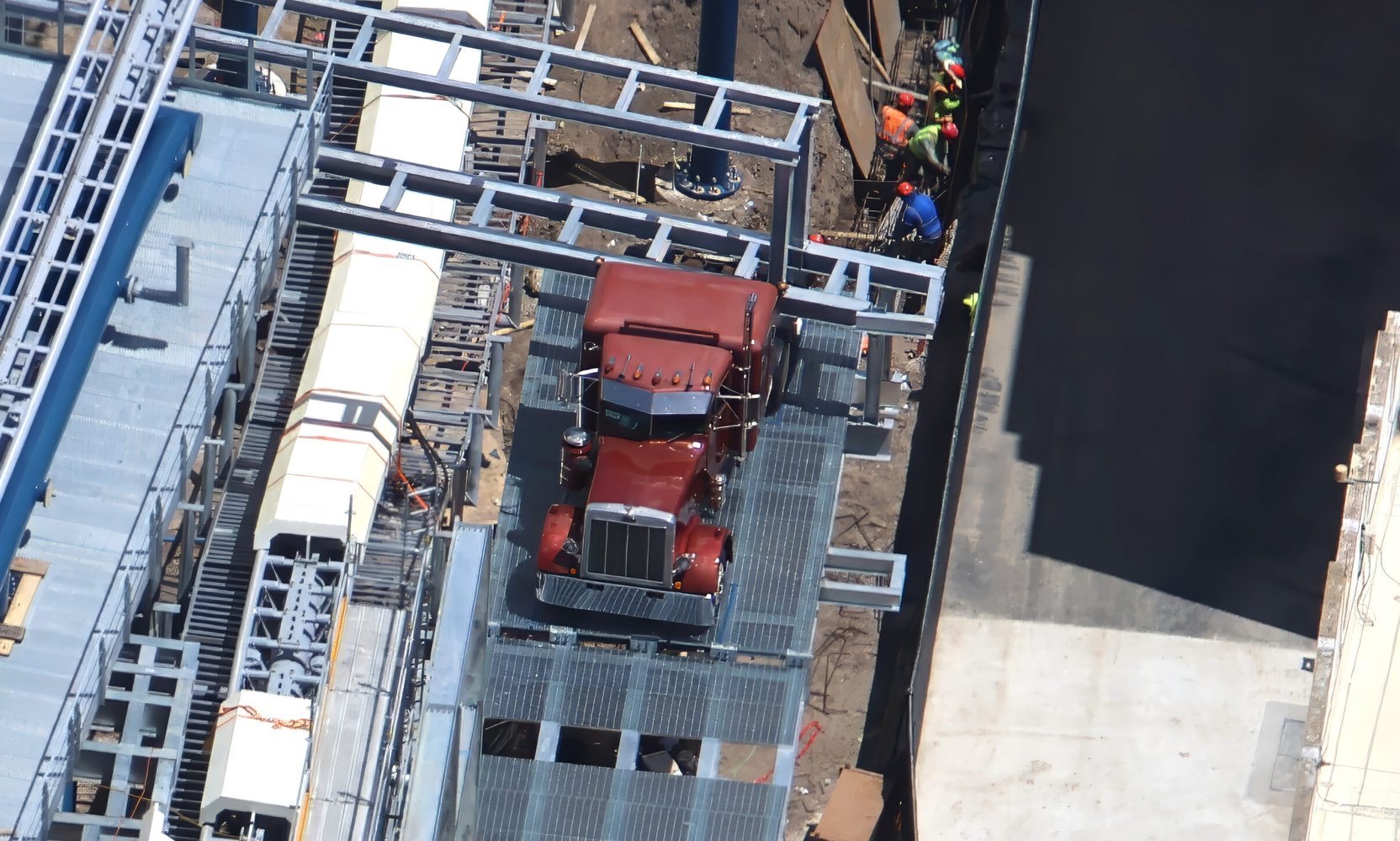 A Burgundy Peterbilt Style Truck Cab Sits Beside the Hollywood Drift Track, One of the First Big Themed Set Pieces in the Coaster Layout