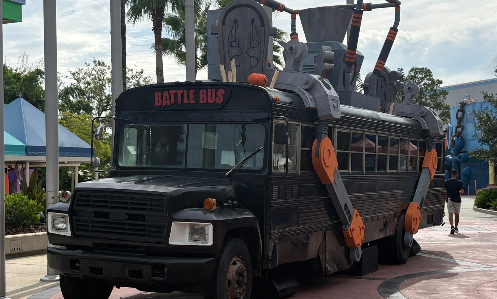 Universal Studios Florida now has a full size Battle Bus, and there is a graveyard where its balloon should be