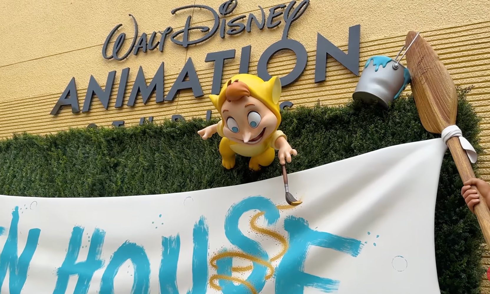 Disney Hung an Open House Banner at The Magic of Disney Animation, and Robin Williams' Lost Boy Is Painting the Swirl on It