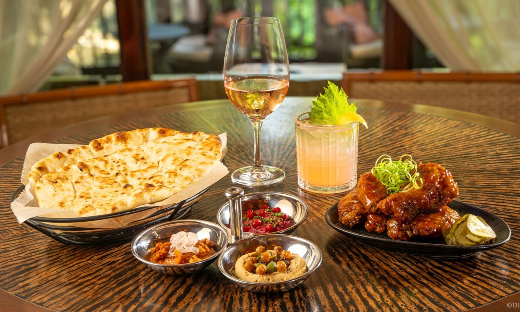 Animal Kingdom's Nomad Lounge Adds Reservations From November 8, and Passholders Get 2 Small Plates and 2 Drinks for $49