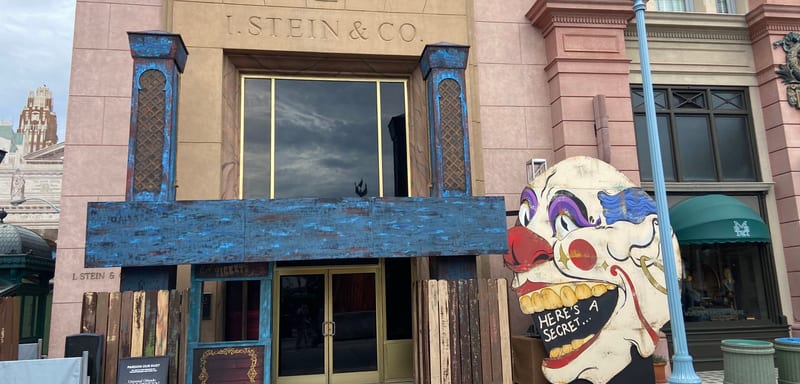A giant clown face and a blue carnival wagon have landed at Universal Studios Florida as Halloween Horror Nights 35 sets go up