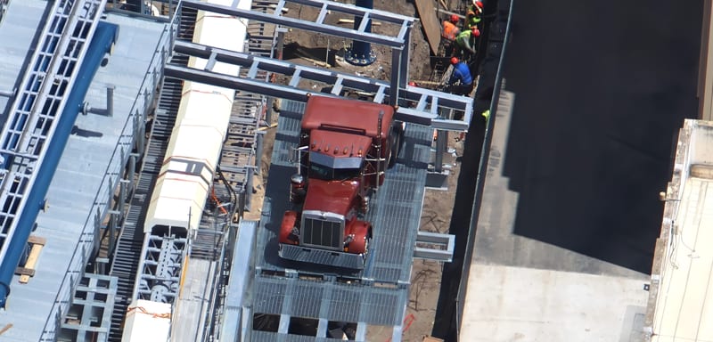 A Burgundy Peterbilt Style Truck Cab Sits Beside the Hollywood Drift Track, One of the First Big Themed Set Pieces in the Coaster Layout