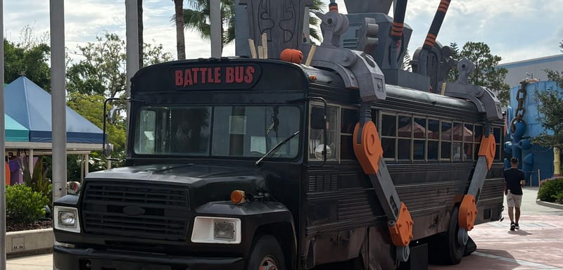 Universal Studios Florida now has a full size Battle Bus, and there is a graveyard where its balloon should be