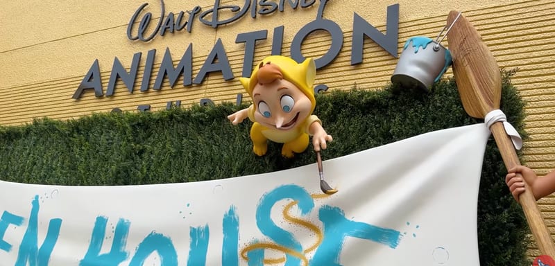Disney Hung an Open House Banner at The Magic of Disney Animation, and Robin Williams' Lost Boy Is Painting the Swirl on It
