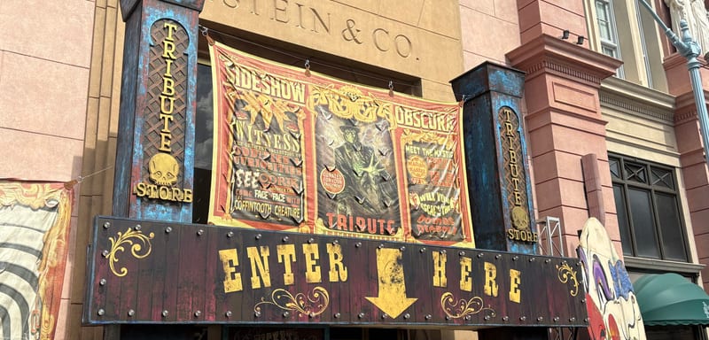 Universal's Sideshow Obscura Tribute Store Has a Skull Card Nodding to Poseidon's Fury, and a Banner Picturing a Tavern It Tore Down in 2008