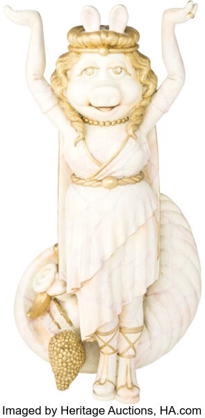 A decorative Miss Piggy figure from MuppetVision 3D, an auction lot