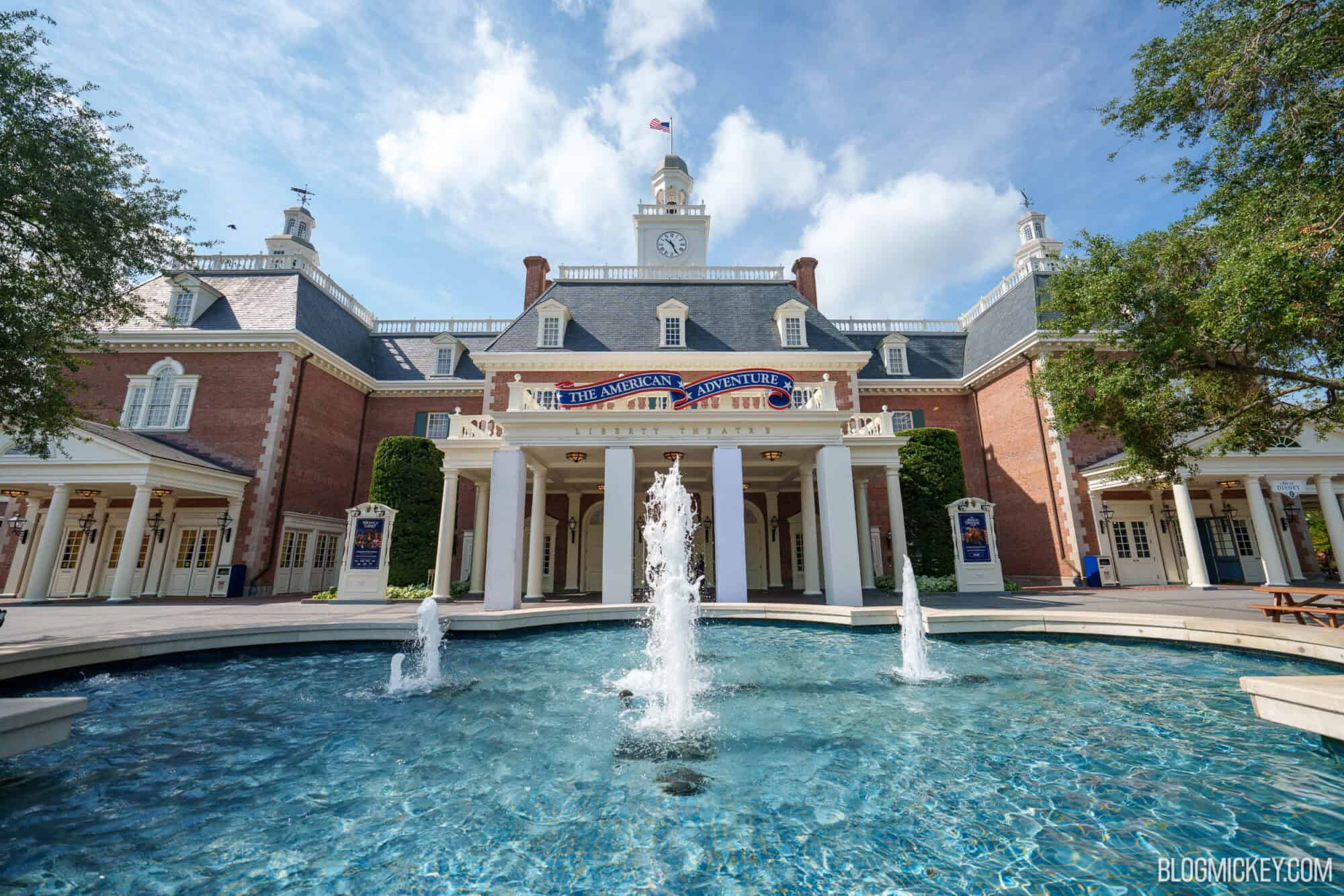 The American Adventure pavilion at EPCOT, seen across its fountain on a sunny day