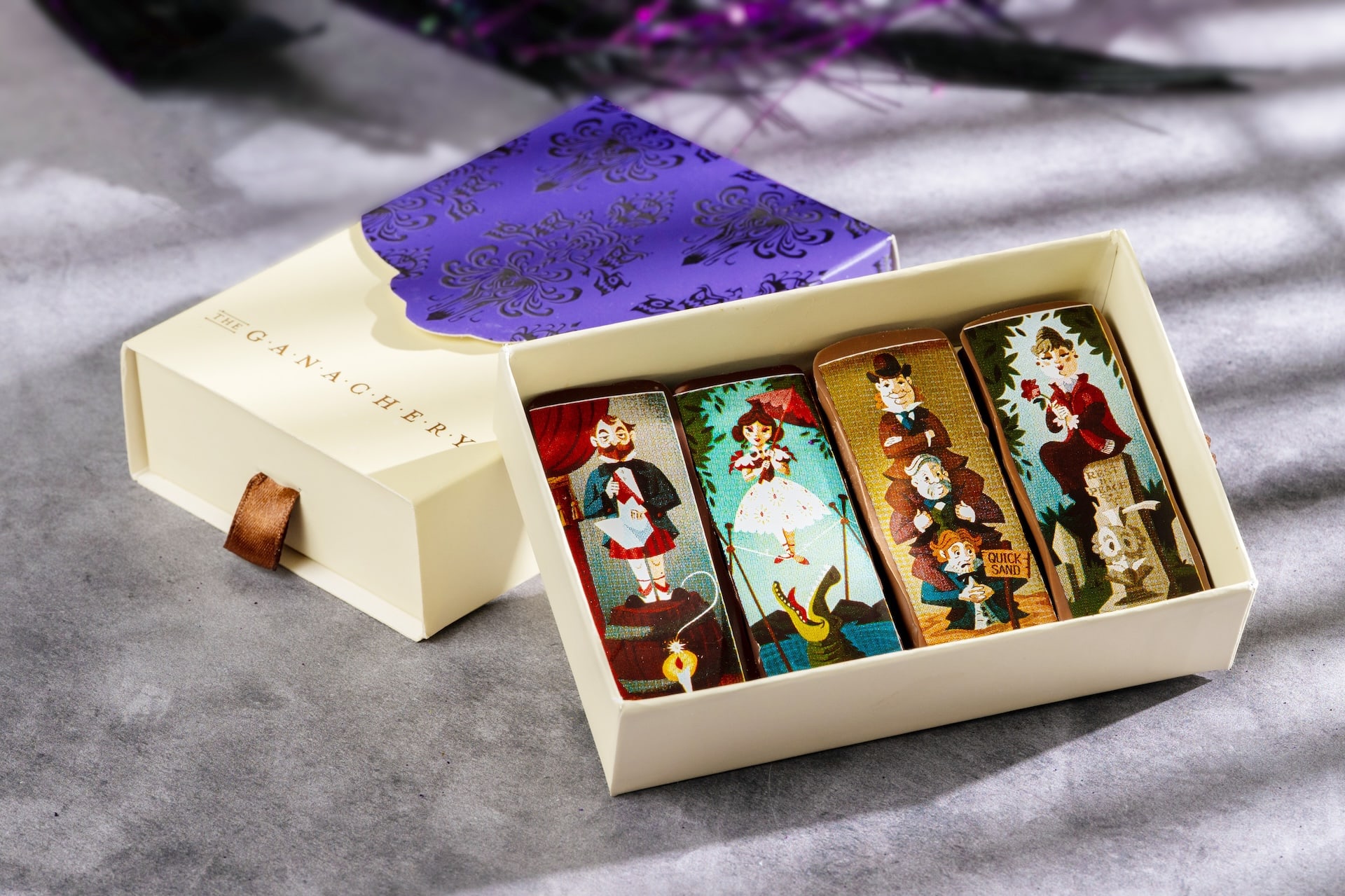 Haunted Mansion Portrait Bars at The Ganachery, four decorated chocolate bars printed with stretching portrait artwork
