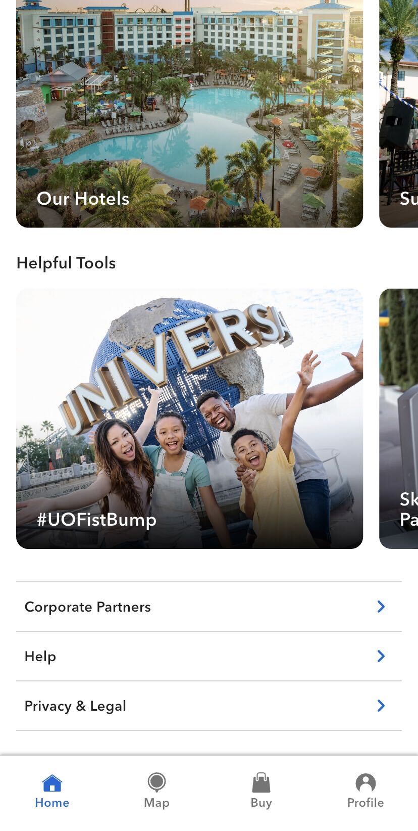 Near the bottom of the Universal Orlando Resort app home screen, showing a Helpful Tools heading and a hashtag U O Fist Bump tile with a photo of a family cheering in front of the Universal globe.