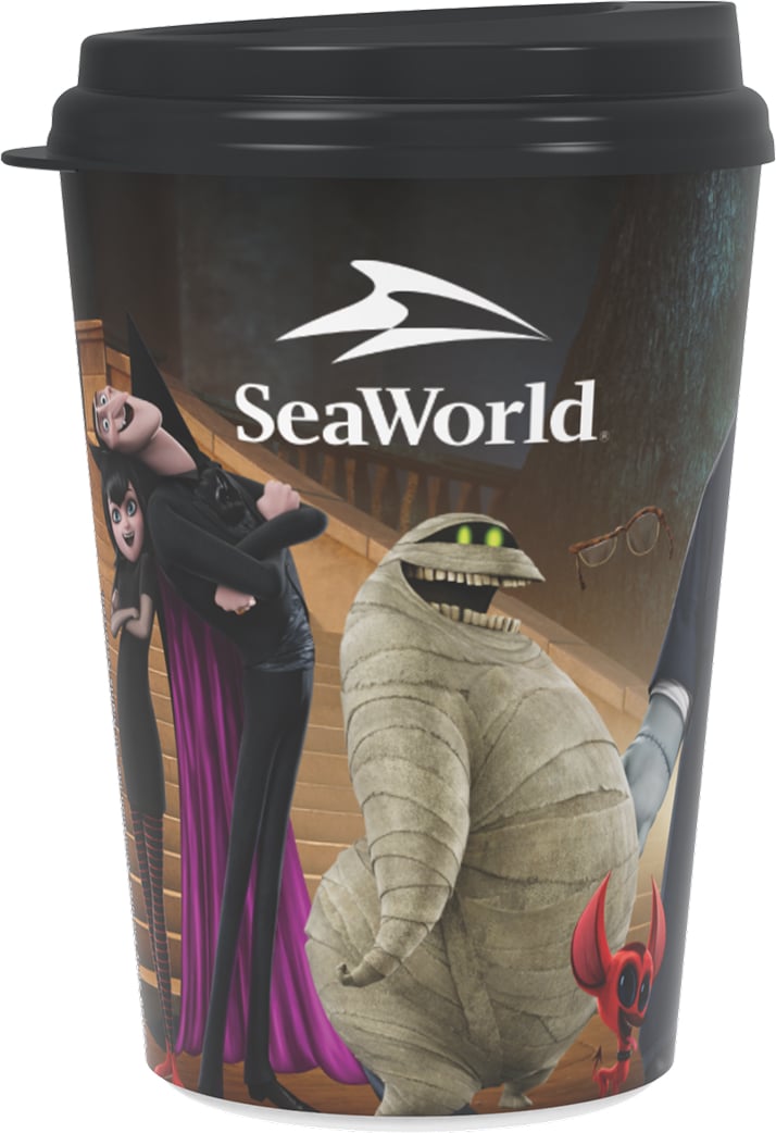 A souvenir plastic tumbler with a black domed lid, printed with Hotel Transylvania characters and the SeaWorld logo