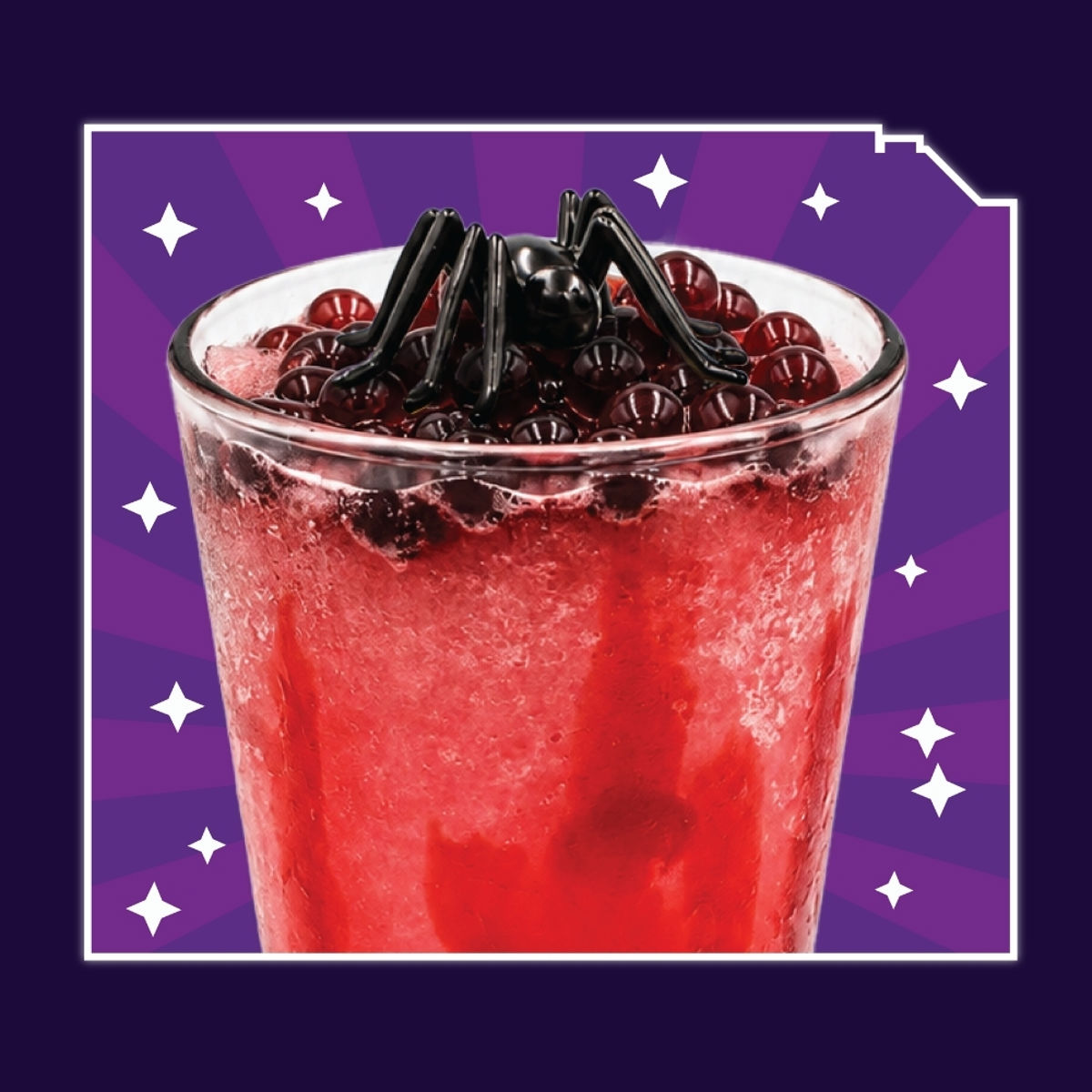 A clear glass of red frozen lemonade, its surface completely covered in dark red boba pearls, with a large glossy black spider standing on top, on a purple starburst background.