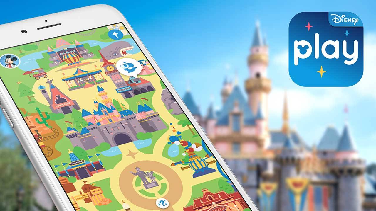 A white phone floating at an angle, showing the Play Disney Parks app's colorful illustrated park map, with a blurred Sleeping Beauty Castle behind it and the blue Disney play app icon in the top right corner