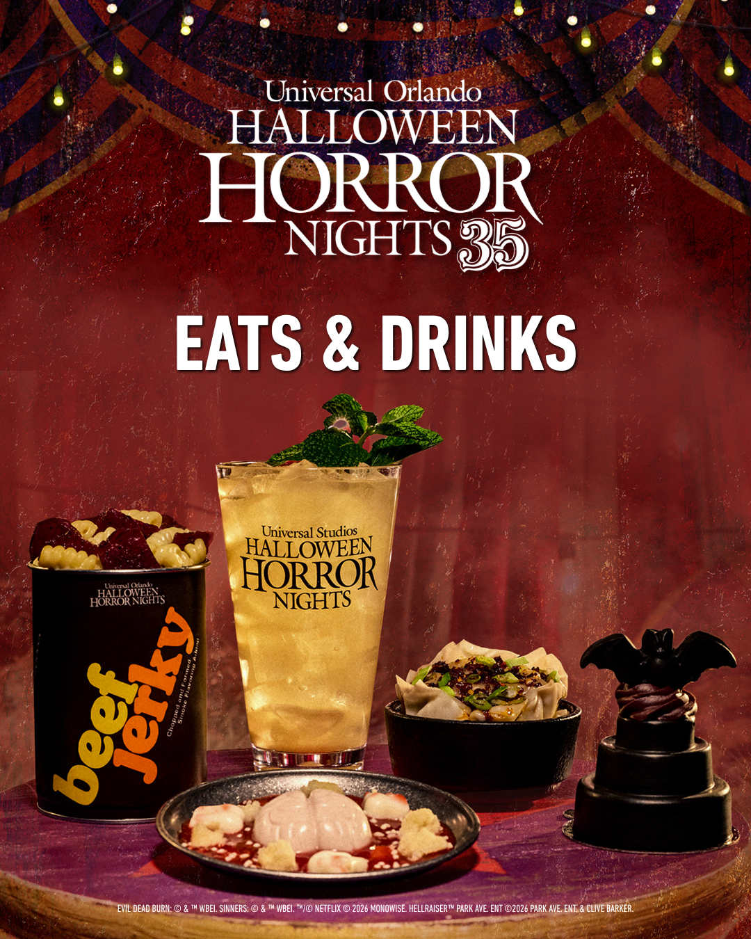 Halloween Horror Nights 35 Eats and Drinks key art with a red carnival tent backdrop, showing a beef jerky can, a tall cocktail, a bowl of dumplings, a molded brain on a plate and a small black tiered cake topped with a bat