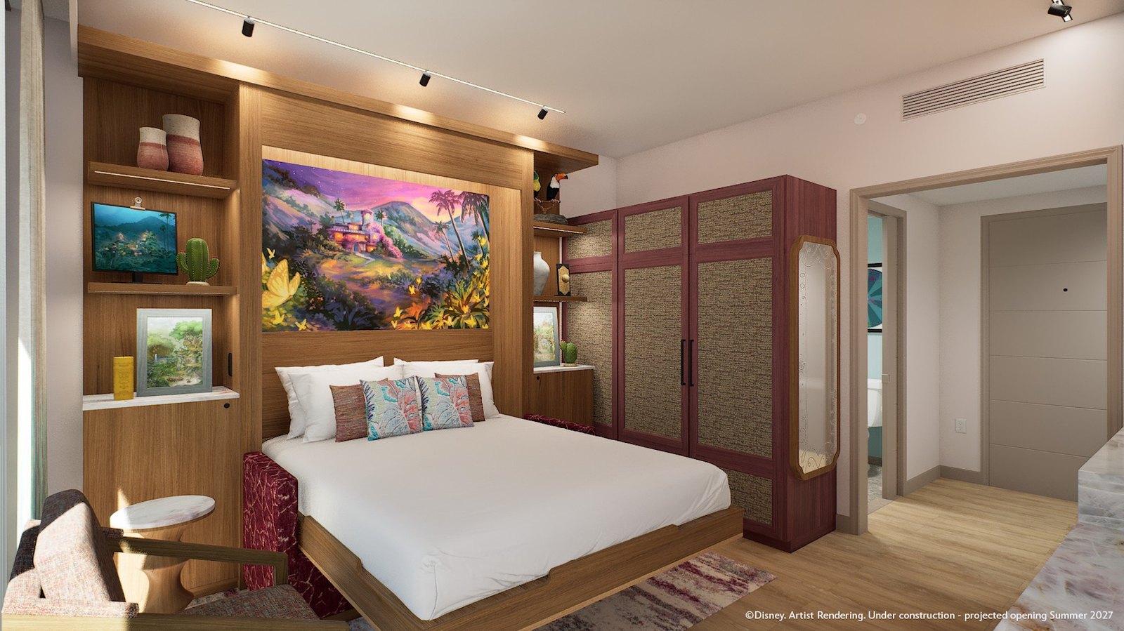 Hotel room rendering with a queen pull-down bed beneath a large lit painting of a house on a purple mountainside surrounded by yellow butterflies, with wood shelving holding pottery and a toucan figurine and burgundy woven wardrobe doors alongside
