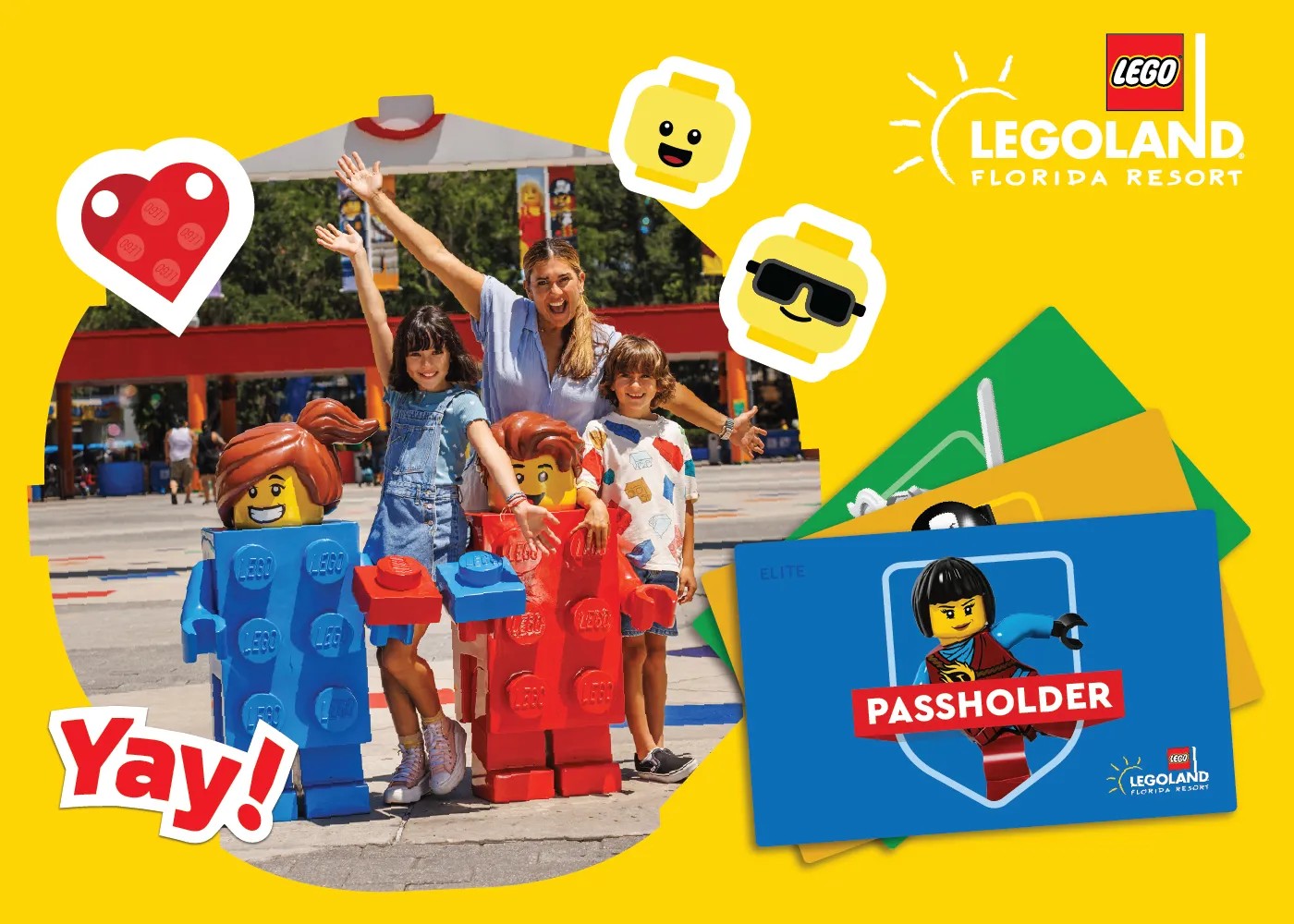 Yellow Legoland passholder module showing a family beside LEGO brick statues and a fanned stack of pass cards, the top one labeled ELITE