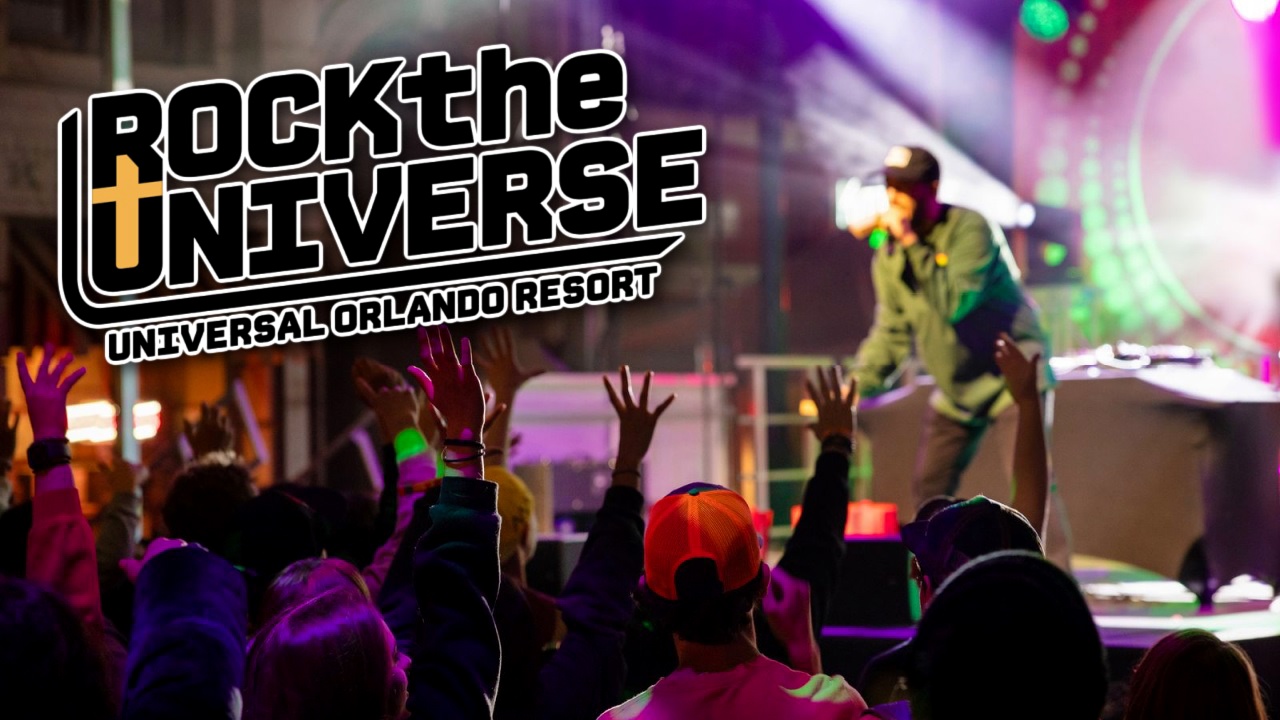 The Rock the Universe key art, the event logo in heavy black block letters with a gold cross forming the U of UNIVERSE, above the words Universal Orlando Resort, laid over the same night time concert photograph.