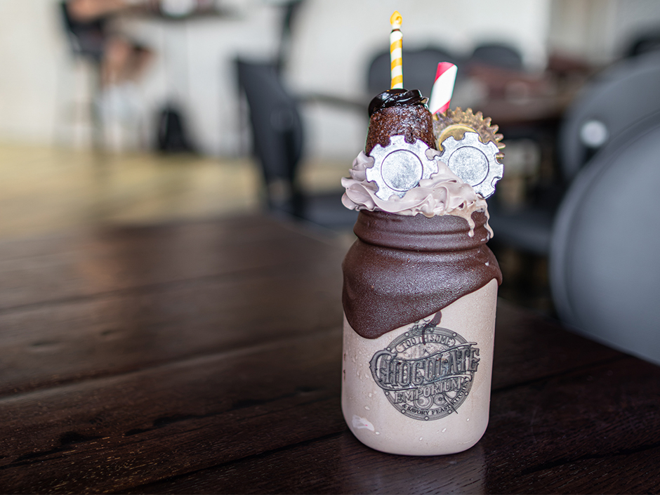 The Cheers to 10 Years! shake at Toothsome, a chocolate-dipped mason jar topped with chocolate gears and a chocolate candle