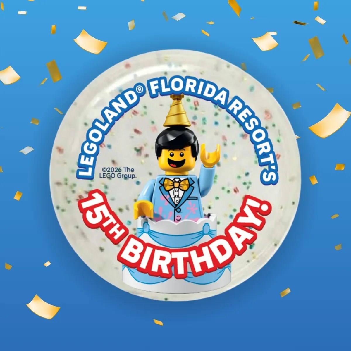 A round Pop Badge showing a LEGO minifigure in a party hat and blue suit popping out of a cake, with the words LEGOLAND Florida Resort's 15th Birthday