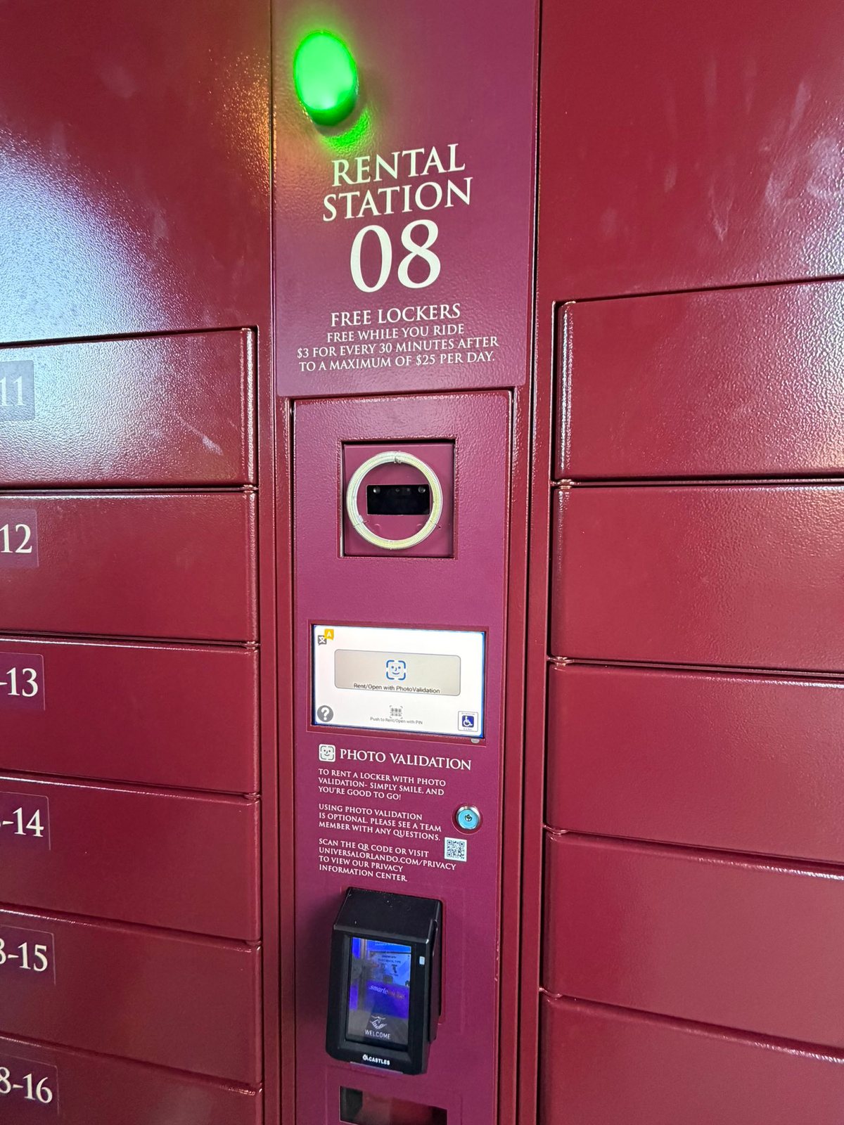 A burgundy locker bank with Rental Station 08, a ring-lit camera, a touchscreen and a Photo Validation instruction panel above a card reader