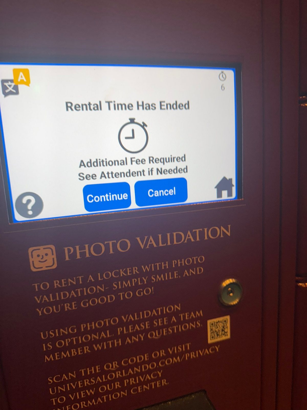 A locker touchscreen reading Rental Time Has Ended, Additional Fee Required, See Attendent if Needed, with Continue and Cancel buttons, above the Photo Validation instructions