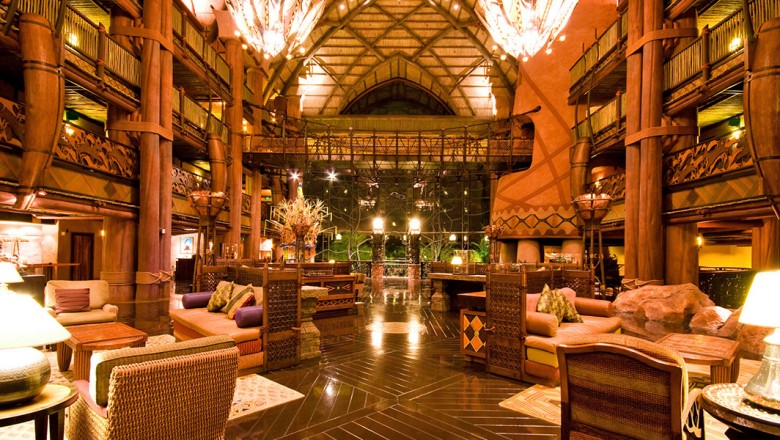 The six-story thatched lobby at Disney's Animal Kingdom Lodge features hand-carved railings, a suspension bridge, and African artifacts