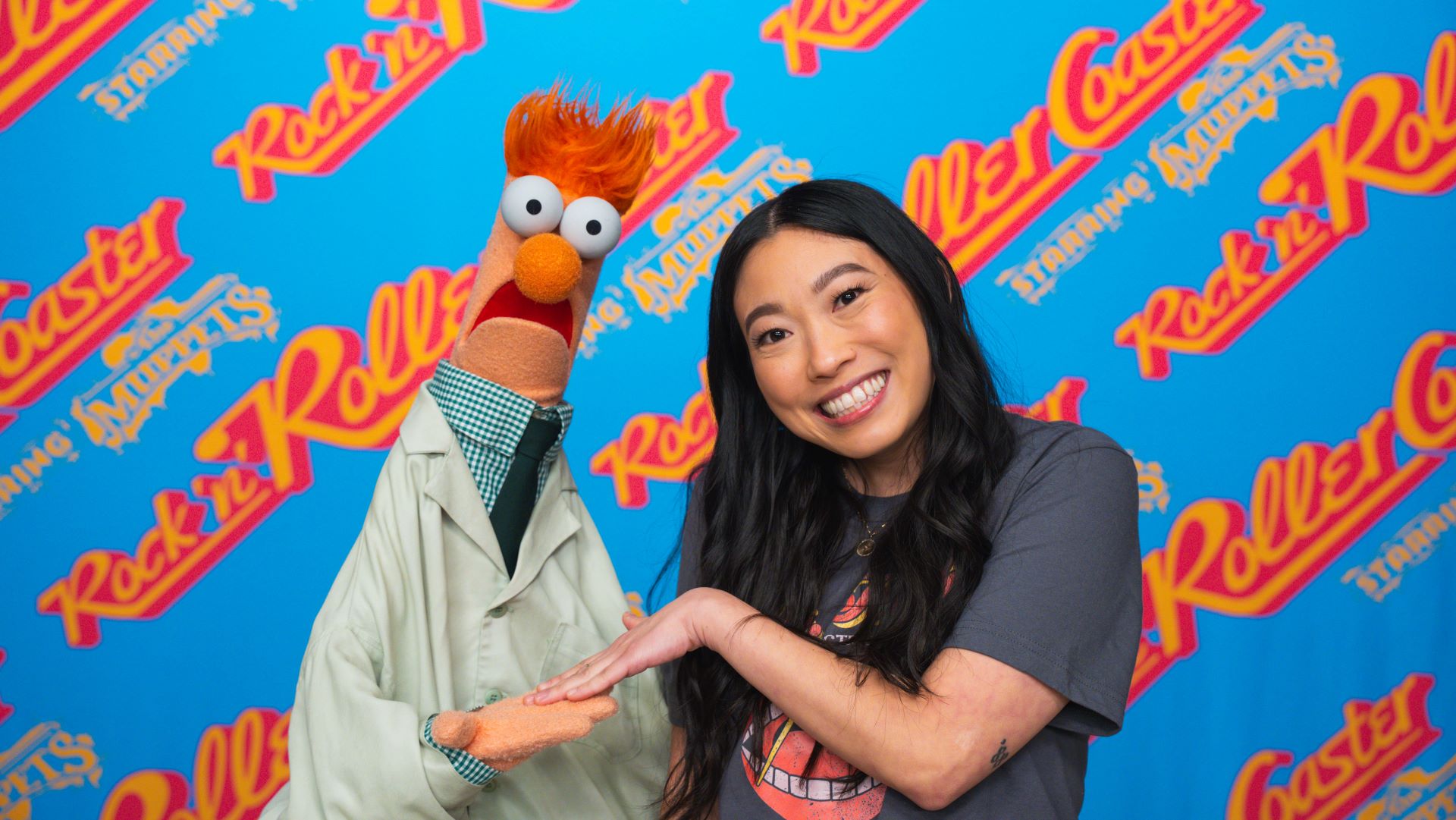Awkwafina poses with The Muppets in promotional art for Rock 'n' Roller Coaster Starring The Muppets at Disney's Hollywood Studios.