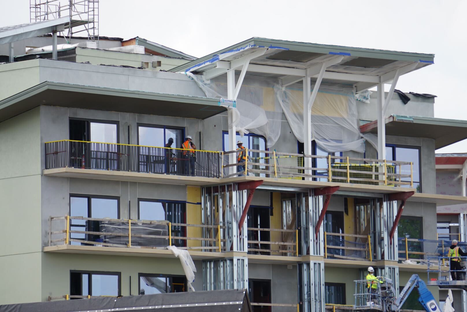 Balcony railings installed on Disney Lakeshore Lodge guestroom wings, offering a preview of lake-facing rooms