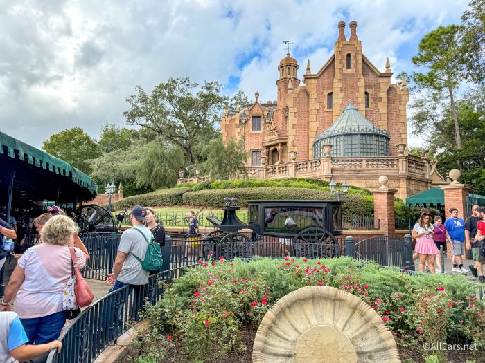 Exterior of the Haunted Mansion at Magic Kingdom under an overcast sky