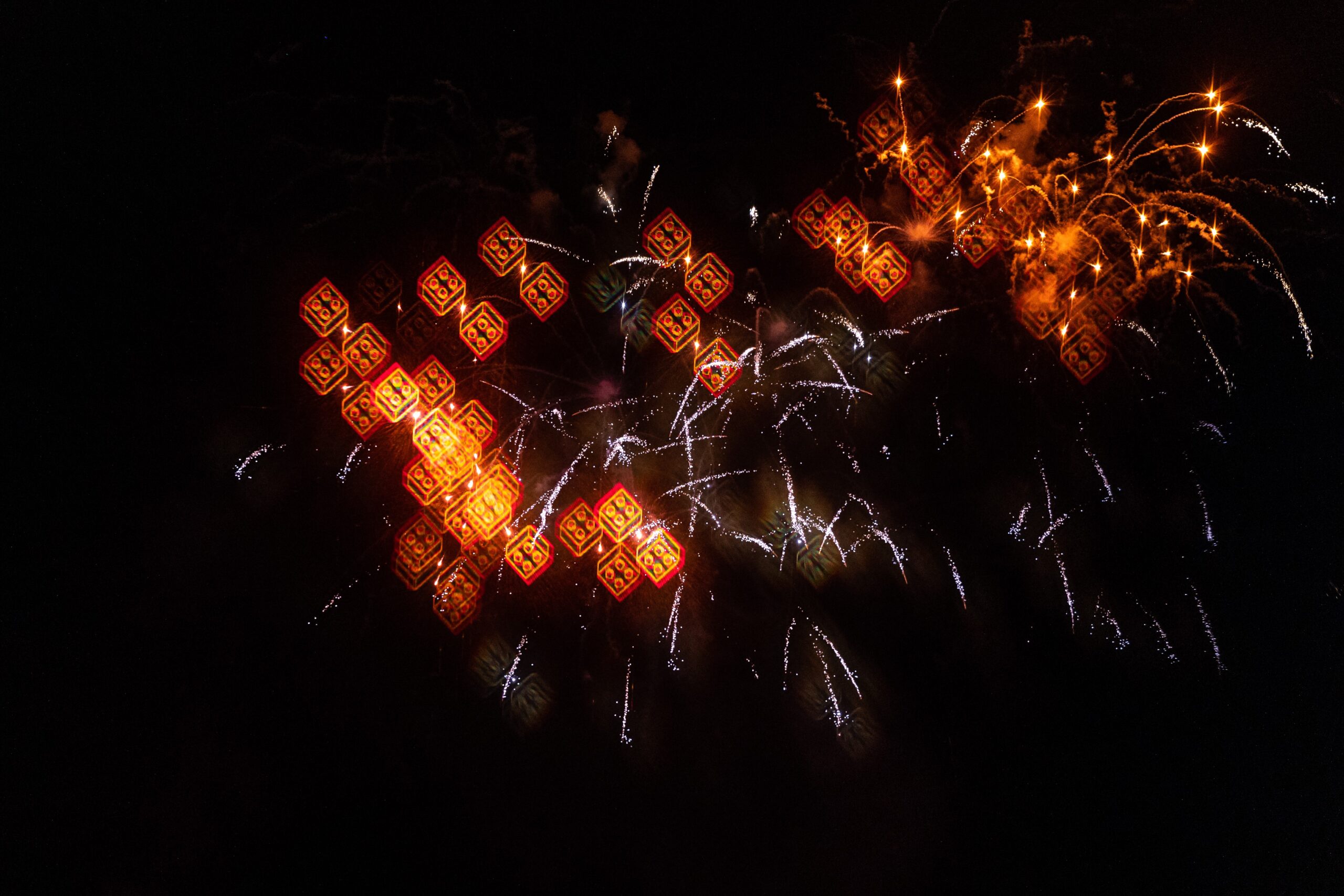 Lakefront fireworks bursts over Lake Eloise at Legoland Florida during Red, White and BOOM!, the park's biggest 4th of July show ever in 2026.