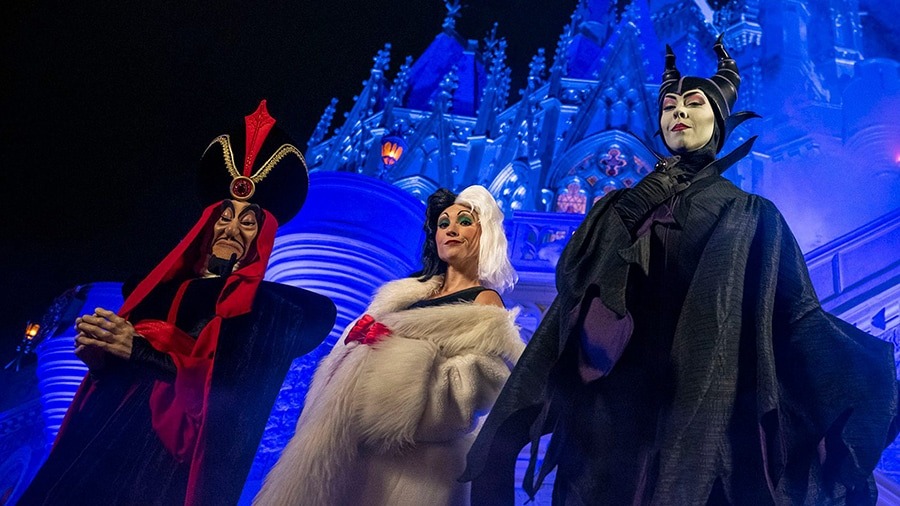 Disney villains Maleficent, Jafar, and Cruella in costume during Mickey's Not-So-Scary Halloween Party at Magic Kingdom.