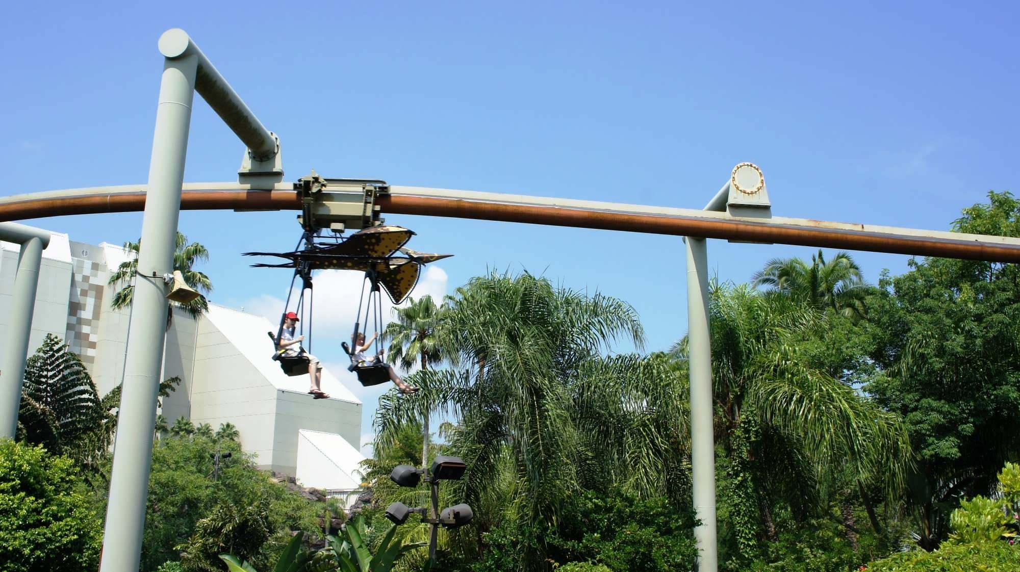 A pteranodon-themed ride vehicle in flight at Pteranodon Flyers, Islands of Adventure.