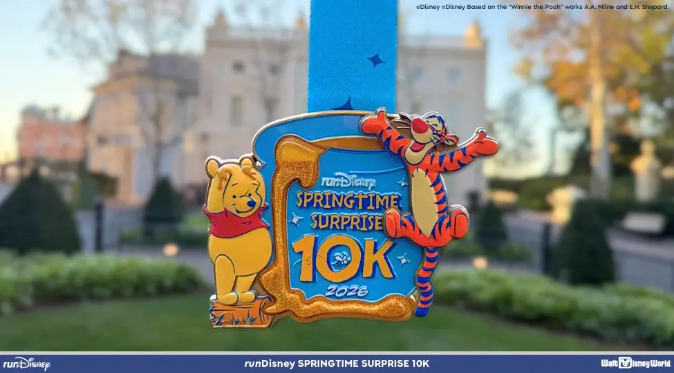 runDisney 2026 Springtime Surprise 10K honey-pot finisher medal with Winnie the Pooh and Tigger