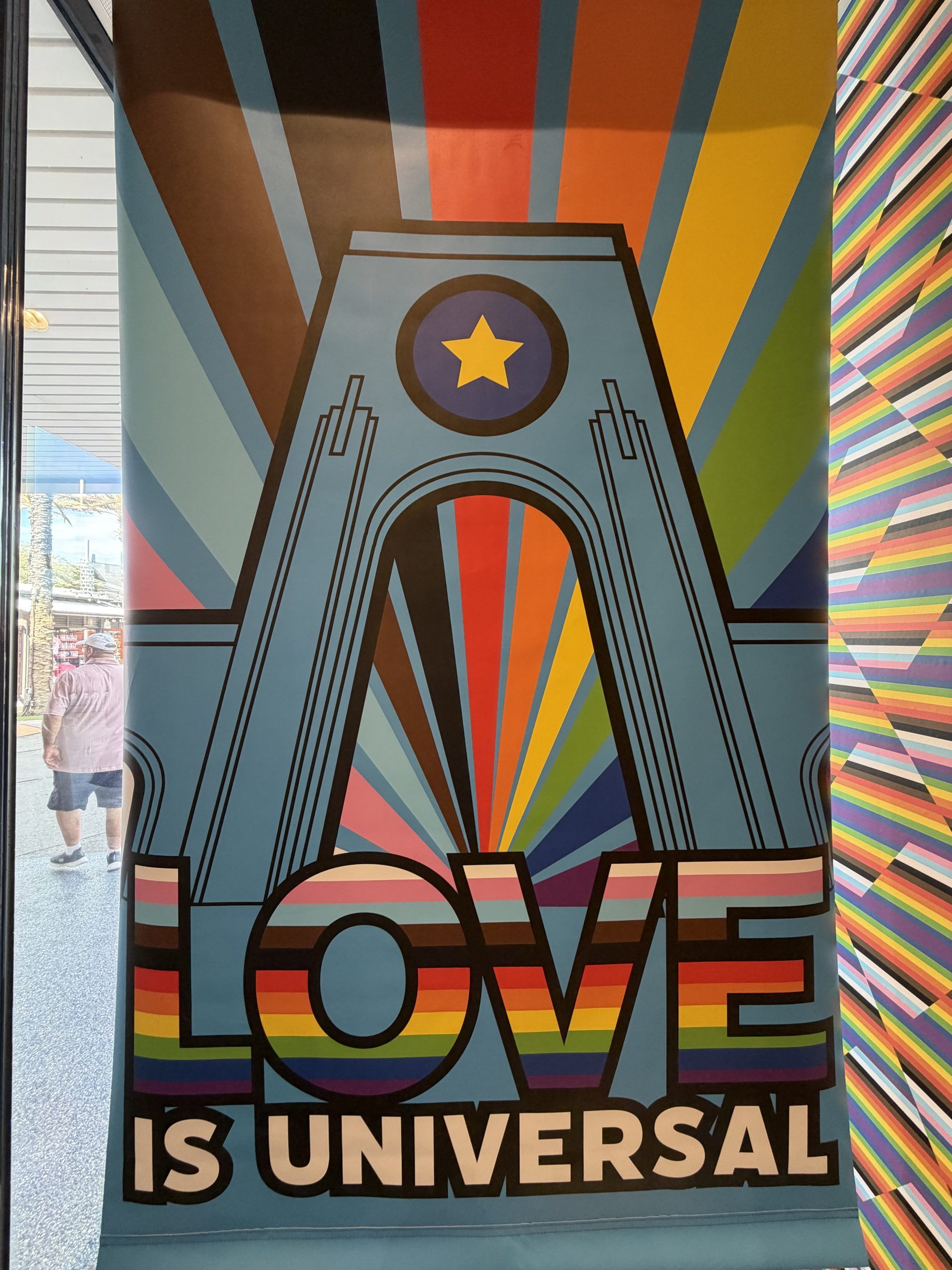 Universal Orlando 2026 Love is Universal Spirit Jersey on display at the Universal Studios Store.