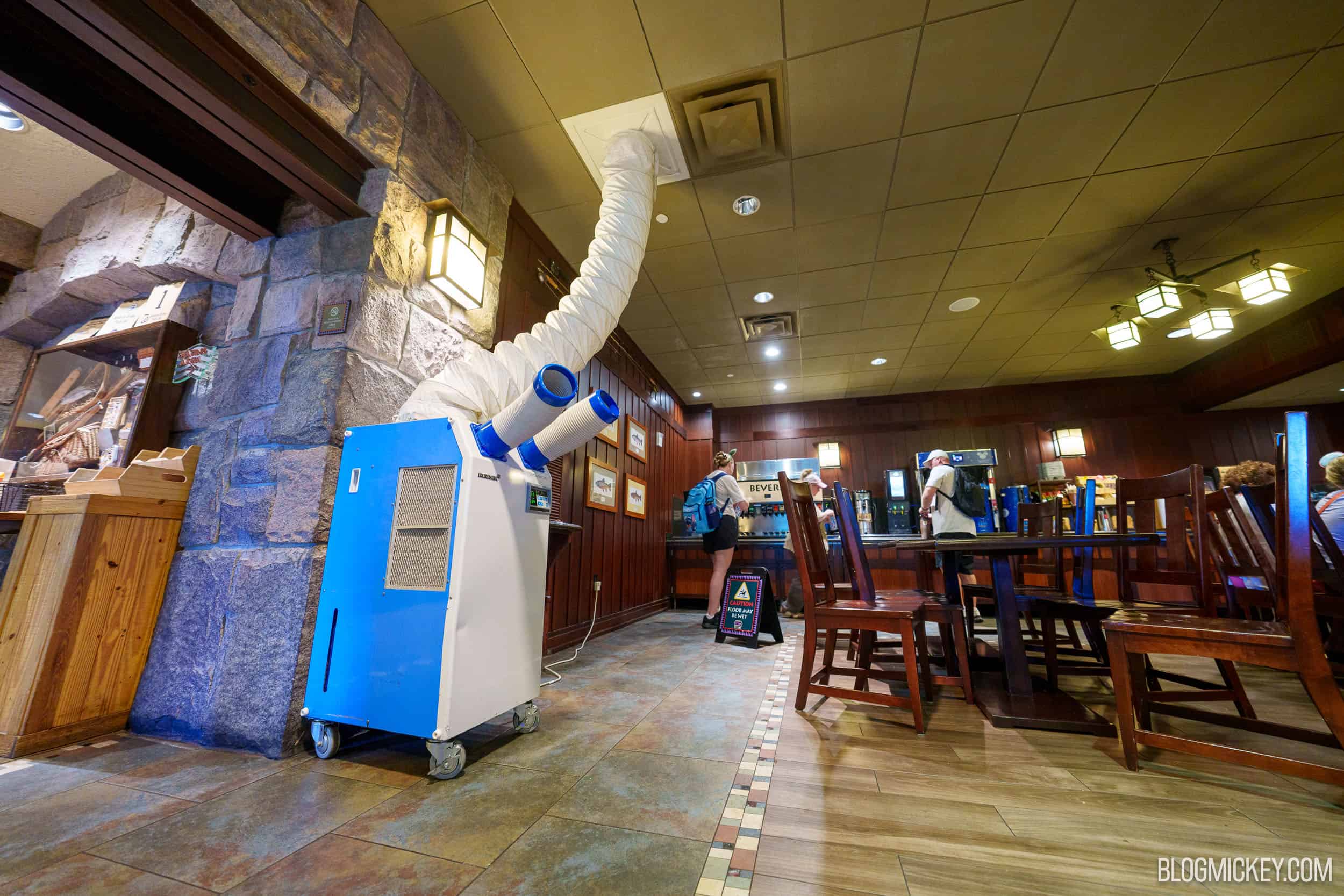Portable cooling units and silver ducting set up inside Disney's Wilderness Lodge during the air conditioning outage.